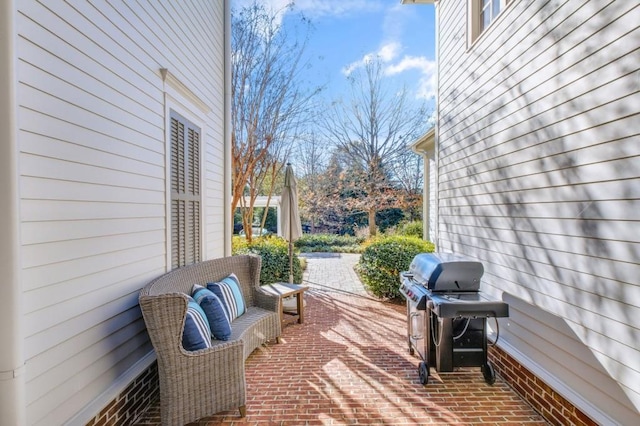 view of patio with a grill and an outdoor living space