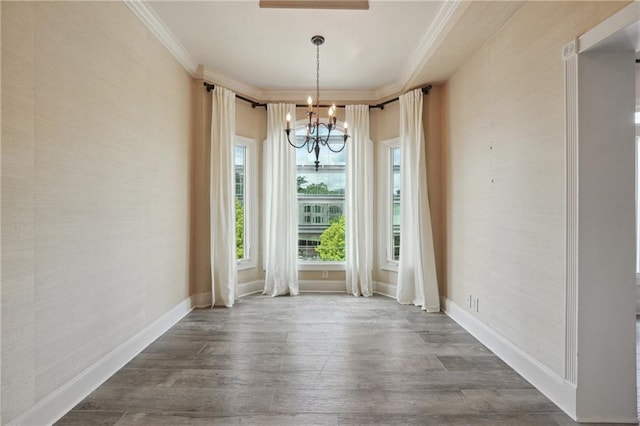 3636 Peachtree Rd NE Unit 405, Atlanta, GA 30319 - unfurnished dining area featuring a chandelier, dark wood-style floors, and crown molding