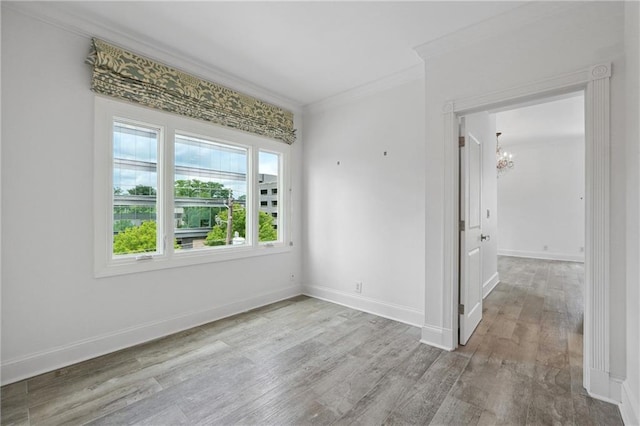 3636 Peachtree Rd NE Unit 405, Atlanta, GA 30319 - empty room with a chandelier, crown molding, and wood finished floors