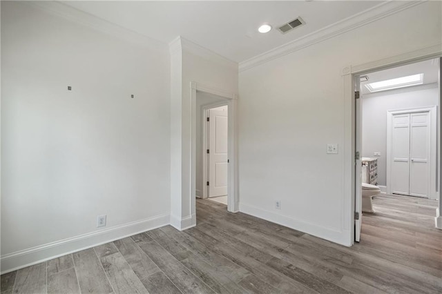 3636 Peachtree Rd NE Unit 405, Atlanta, GA 30319 - spare room with wood finished floors and crown molding