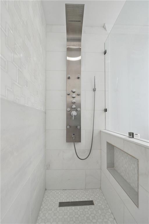 3636 Peachtree Rd NE Unit 405, Atlanta, GA 30319 - full bath with a tile shower