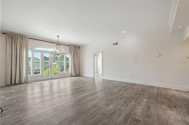 3636 Peachtree Rd NE Unit 405, Atlanta, GA 30319 - empty room featuring a chandelier, wood finished floors, and crown molding