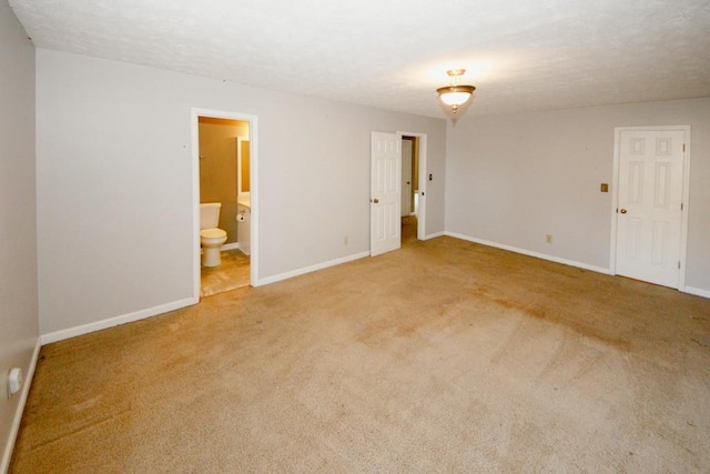 unfurnished room featuring carpet