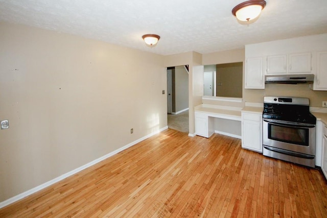 kitchen featuring white cabinetry, stainless steel range, and light hardwood / wood-style flooring