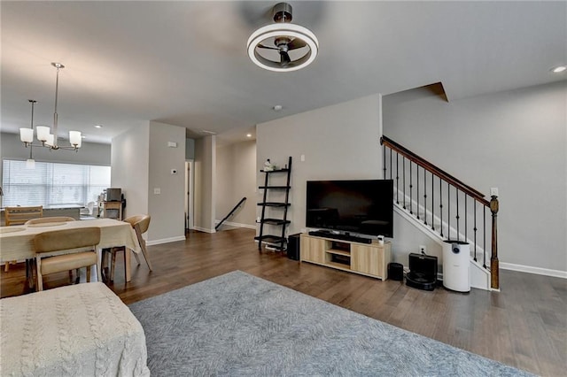 2719 Hedgeway Cir, Kennesaw, GA 30144 - living room featuring wood finished floors, a chandelier, recessed lighting, and stairway