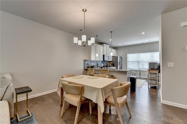 2719 Hedgeway Cir, Kennesaw, GA 30144 - dining space featuring a chandelier, dark wood finished floors, and recessed lighting