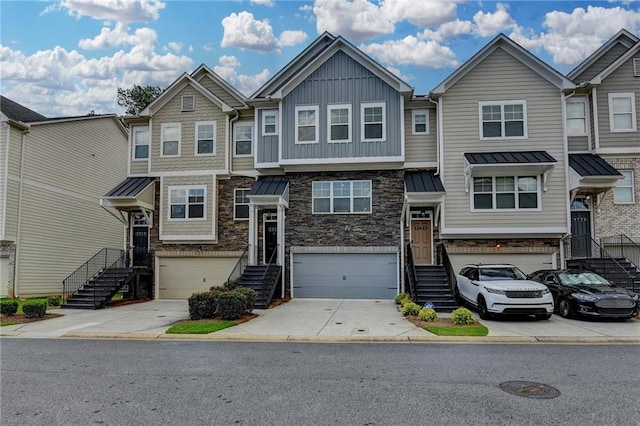 2719 Hedgeway Cir, Kennesaw, GA 30144 - view of property with concrete driveway, an attached garage, stone siding, and stairway