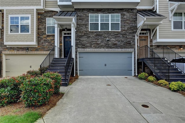 2719 Hedgeway Cir, Kennesaw, GA 30144 - view of front of home with stone siding, a garage, and concrete driveway