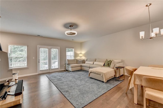 2719 Hedgeway Cir, Kennesaw, GA 30144 - living area with wood finished floors and a chandelier