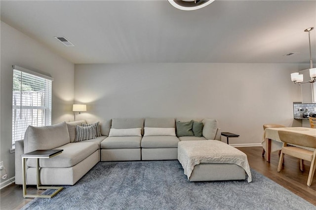 2719 Hedgeway Cir, Kennesaw, GA 30144 - living room featuring wood finished floors and a chandelier