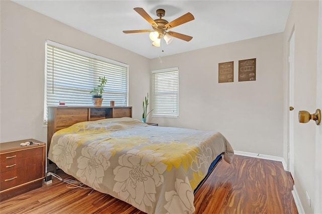 bedroom featuring hardwood / wood-style flooring and ceiling fan