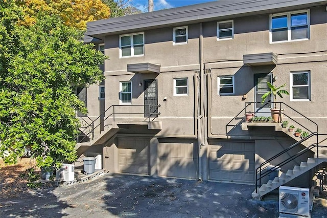 view of front of property featuring ac unit