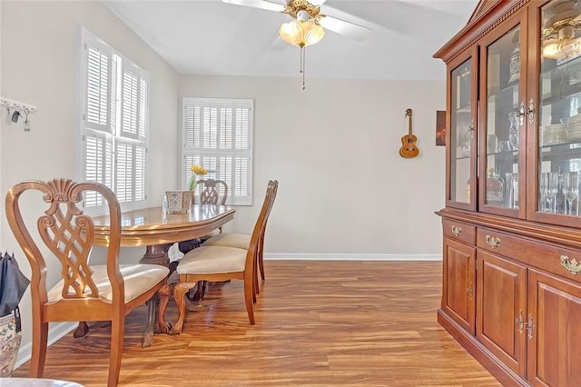 dining space featuring light hardwood / wood-style floors and ceiling fan