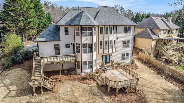 6350 Old Wood Hollow Way, Buford, GA 30518 - back of property with stairs, a wooden deck, and roof with shingles