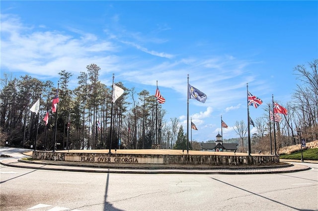 6350 Old Wood Hollow Way, Buford, GA 30518 - view of asphalt street featuring curbs and traffic signs