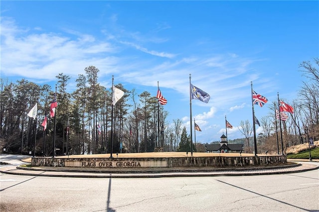 6350 Old Wood Hollow Way, Buford, GA 30518 - view of asphalt road with traffic signs and curbs