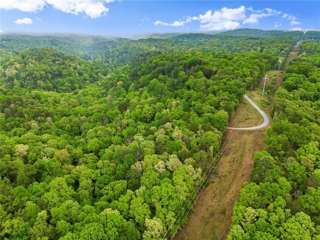 aerial view featuring a wooded view