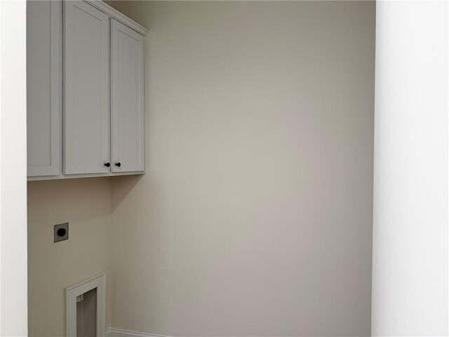 kitchen with white cabinets, hanging light fixtures, sink, and appliances with stainless steel finishes