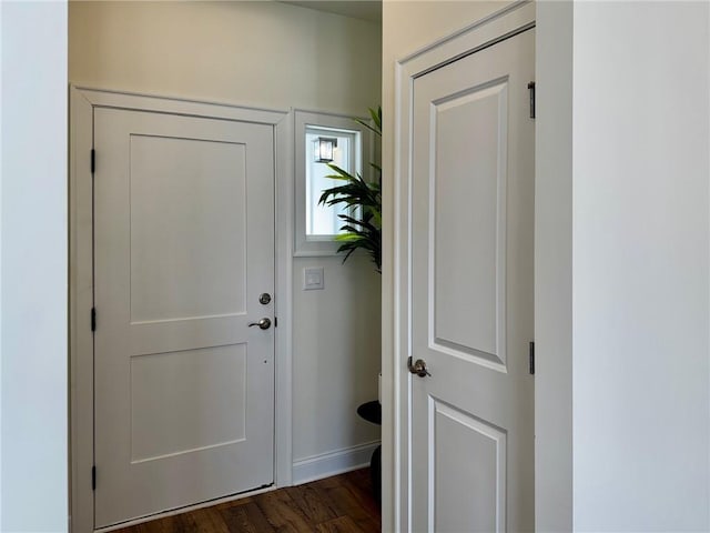 dining room with crown molding and dark wood-type flooring