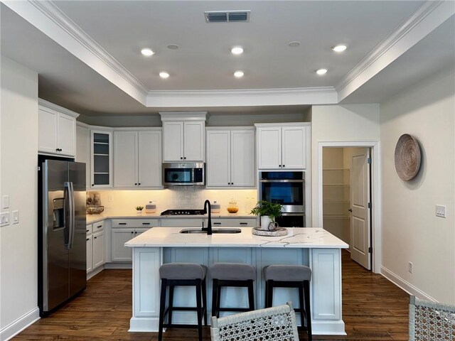 living room featuring hardwood / wood-style flooring and crown molding