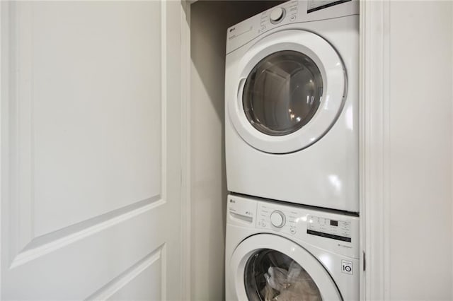 laundry area featuring laundry area and stacked washer / dryer