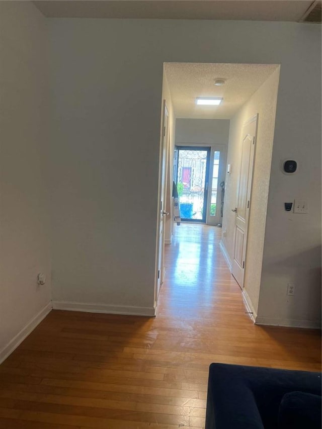 116 Madeline Ct, Mcdonough, GA 30253 - hallway featuring light wood finished floors and baseboards