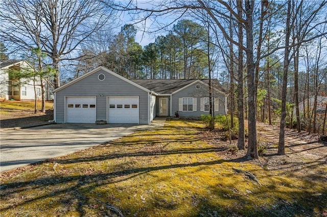 view of front of home with driveway and an attached garage