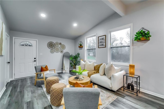 living room featuring hardwood / wood-style flooring and lofted ceiling with beams