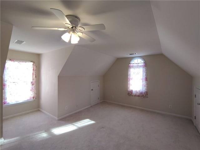 bonus room featuring vaulted ceiling, baseboards, and visible vents