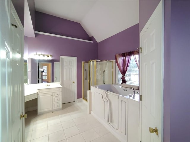 full bath with vanity, tile patterned flooring, vaulted ceiling, a shower stall, and a bath