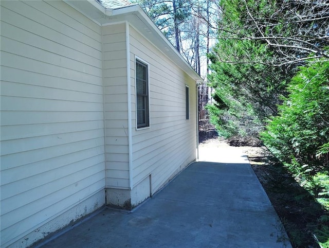 view of side of property featuring a patio area