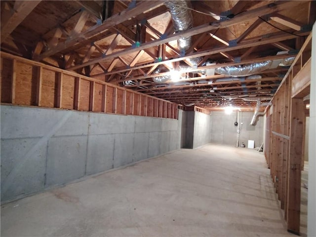 hallway featuring baseboards, visible vents, and light wood-style floors