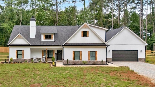 3088 Hiram Sudie Rd, Hiram, GA 30141 - modern farmhouse style home with gravel driveway, covered porch, a chimney, an attached garage, and a shingled roof