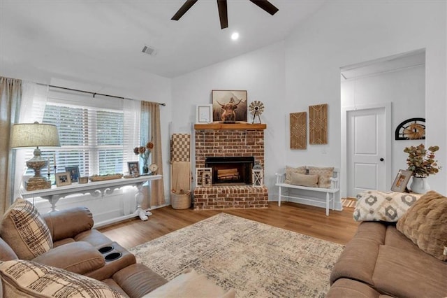 3088 Hiram Sudie Rd, Hiram, GA 30141 - living room featuring ceiling fan, vaulted ceiling, attic access, a fireplace, and wood finished floors