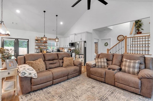 3088 Hiram Sudie Rd, Hiram, GA 30141 - living room with high vaulted ceiling, ceiling fan, wood finished floors, stairway, and recessed lighting