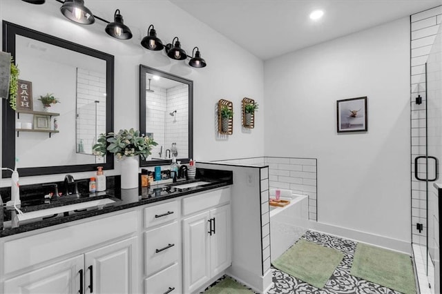 3088 Hiram Sudie Rd, Hiram, GA 30141 - full bathroom featuring a shower stall, double vanity, a garden tub, and recessed lighting