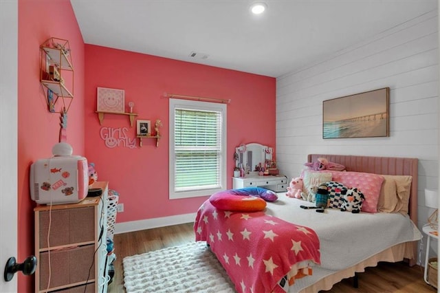 3088 Hiram Sudie Rd, Hiram, GA 30141 - bedroom with wood finished floors, an accent wall, wooden walls, and recessed lighting