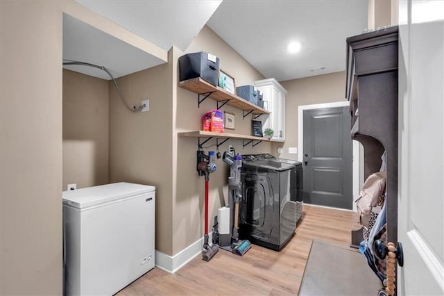 3088 Hiram Sudie Rd, Hiram, GA 30141 - laundry room featuring cabinet space, separate washer and dryer, and light wood-style floors