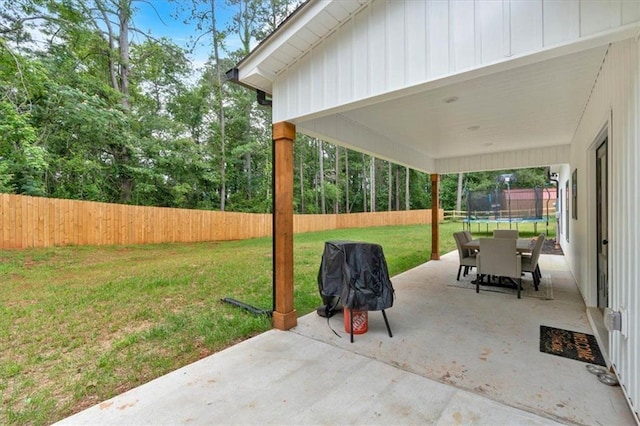 3088 Hiram Sudie Rd, Hiram, GA 30141 - fenced backyard with a trampoline, a patio area, and area for grilling