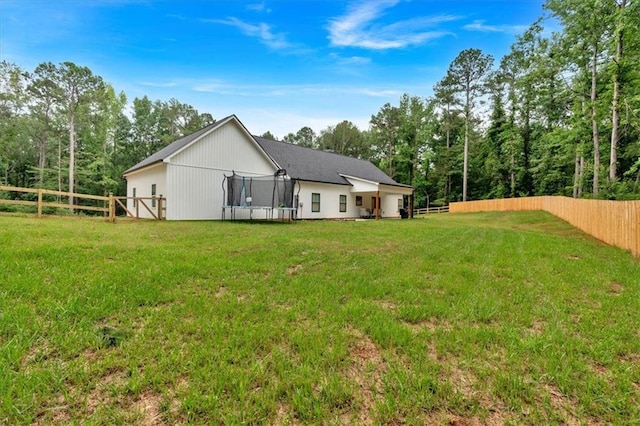 3088 Hiram Sudie Rd, Hiram, GA 30141 - back of property featuring a trampoline and a fenced backyard