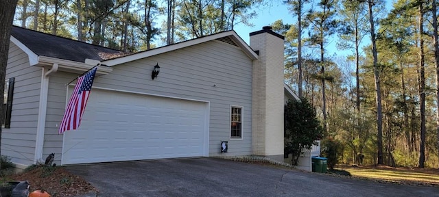 view of side of home with a garage