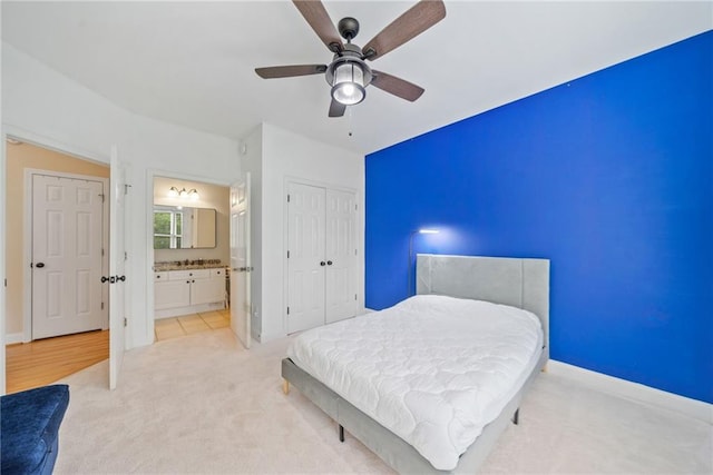 420 Big Bend Trl, Sugar Hill, GA 30518 - bedroom with light carpet, ceiling fan, a closet, ensuite bathroom, and baseboards