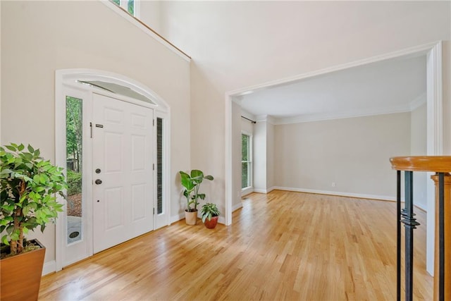 420 Big Bend Trl, Sugar Hill, GA 30518 - entrance foyer with light wood finished floors, baseboards, and crown molding