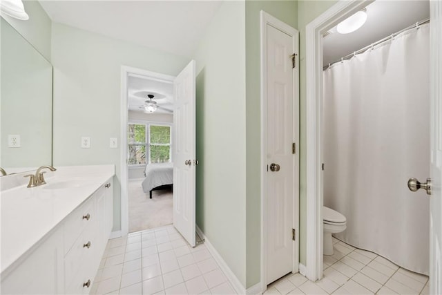 420 Big Bend Trl, Sugar Hill, GA 30518 - full bathroom featuring vanity, tile patterned floors, toilet, ceiling fan, and baseboards