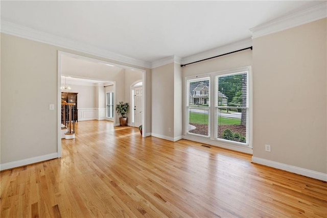 420 Big Bend Trl, Sugar Hill, GA 30518 - unfurnished living room featuring light wood-type flooring, crown molding, a chandelier, and baseboards