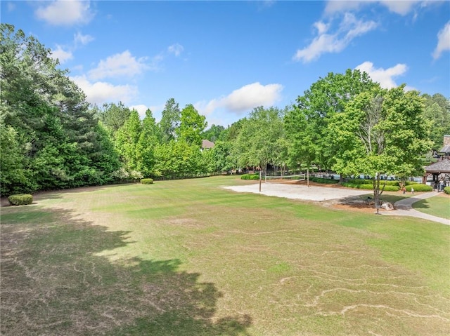 420 Big Bend Trl, Sugar Hill, GA 30518 - view of community featuring volleyball court, a yard, and view of scattered trees