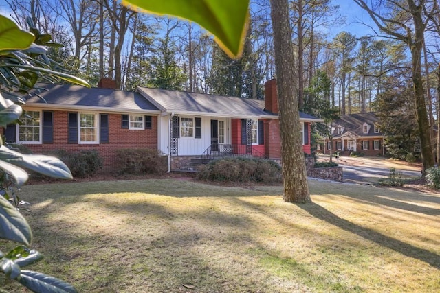 ranch-style house with a front lawn