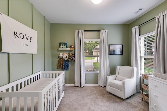 110 Chalfont Cir, Carrollton, GA 30117 - bedroom with multiple windows, light carpet, a nursery area, and baseboards
