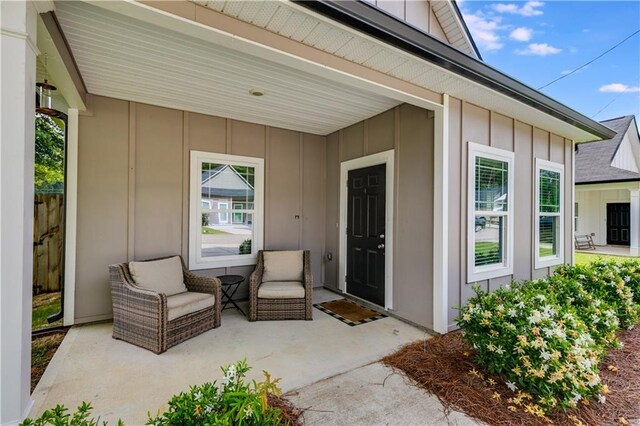 110 Chalfont Cir, Carrollton, GA 30117 - property entrance featuring board and batten siding and a patio
