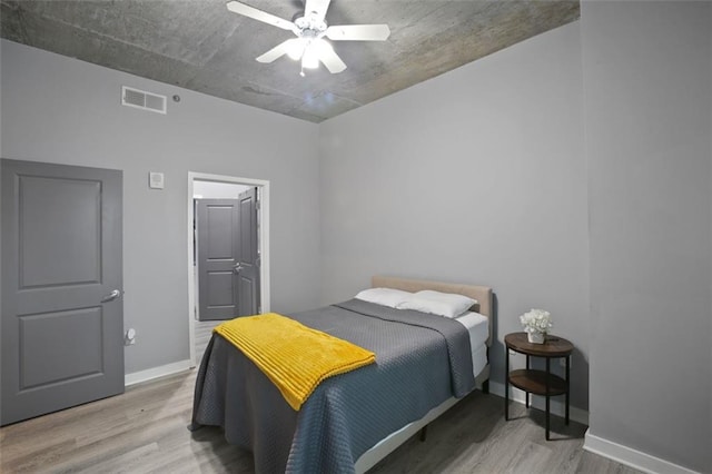 bedroom featuring hardwood / wood-style floors and ceiling fan